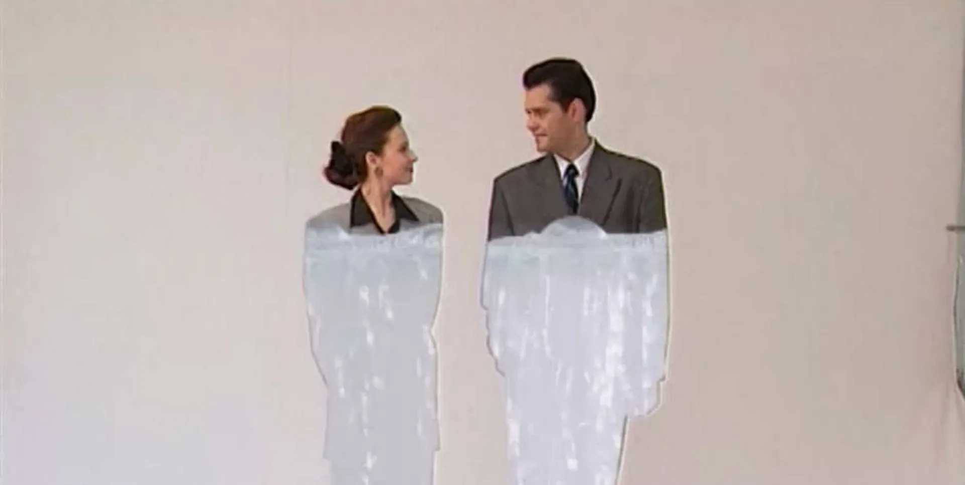 A man and a woman stare at each other in the film Eight Postcards from Utopia